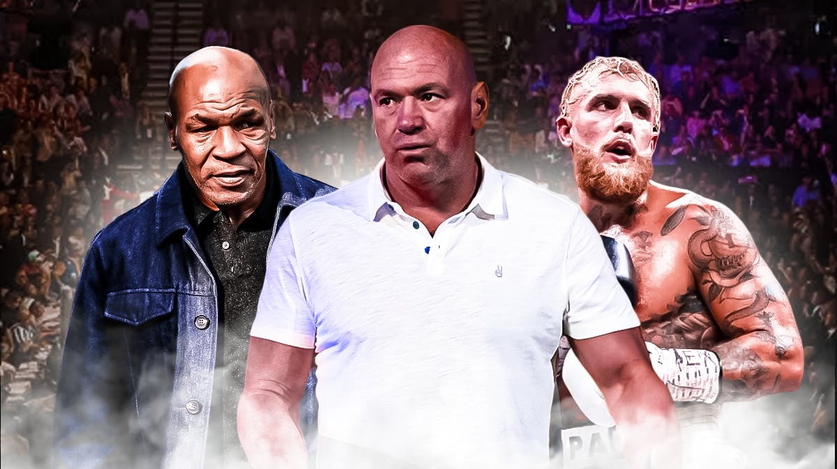 Dana White in the middle of Mike Tyson and Jake Paul.