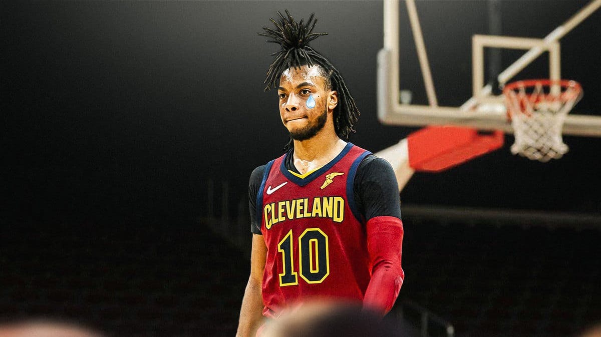 Cavs' Darius Garland looking down with animated tears