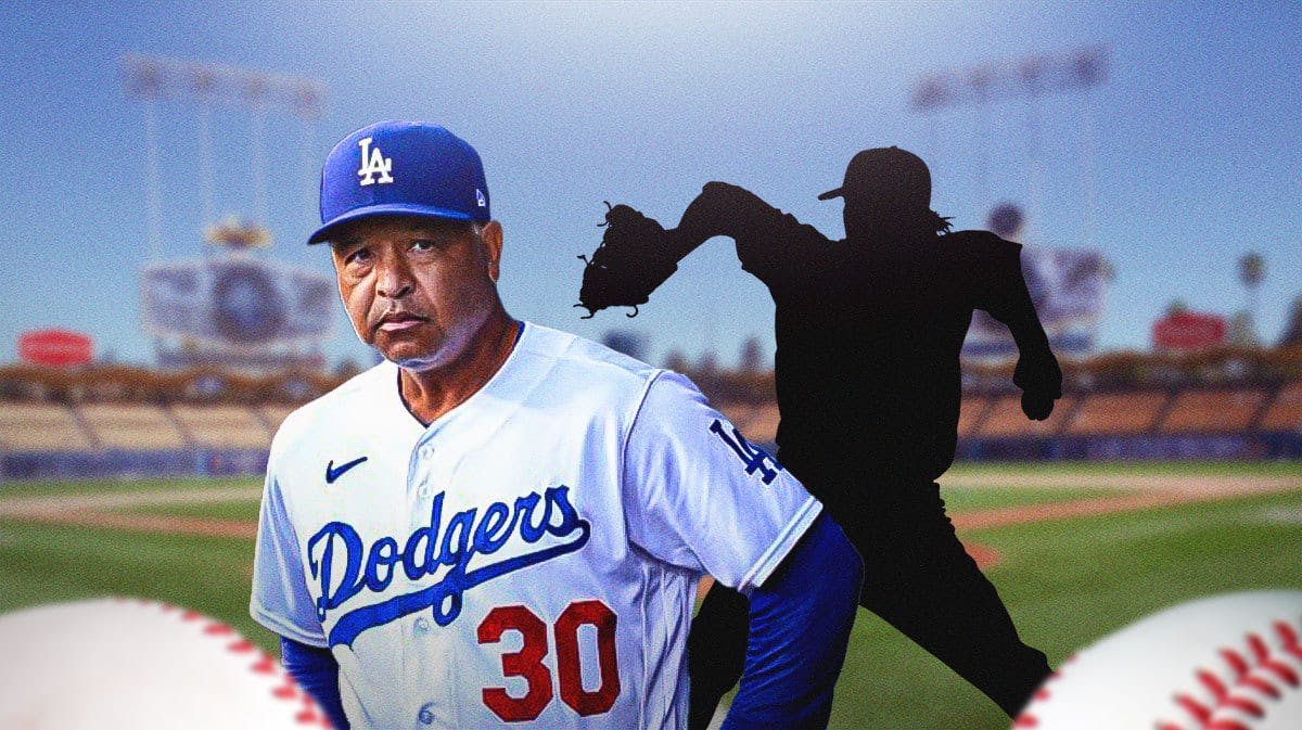 Dodgers manager Dave Roberts with a mystery figure behind him