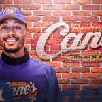 Dodgers' Mookie Betts on left smiling. Need the Raising Cane’s logo on right.