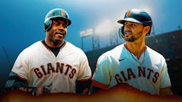 Giants' Michael Conforto staring at a hyped up Barry Bonds (2001 version)