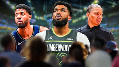 Karl-Anthony Towns front and center, Paul George on the left and Ty Lue on the right. Target Center at the background.