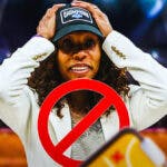 Kentucky women’s basketball coach Kyra Elzy, with the canceled symbol/circle over her