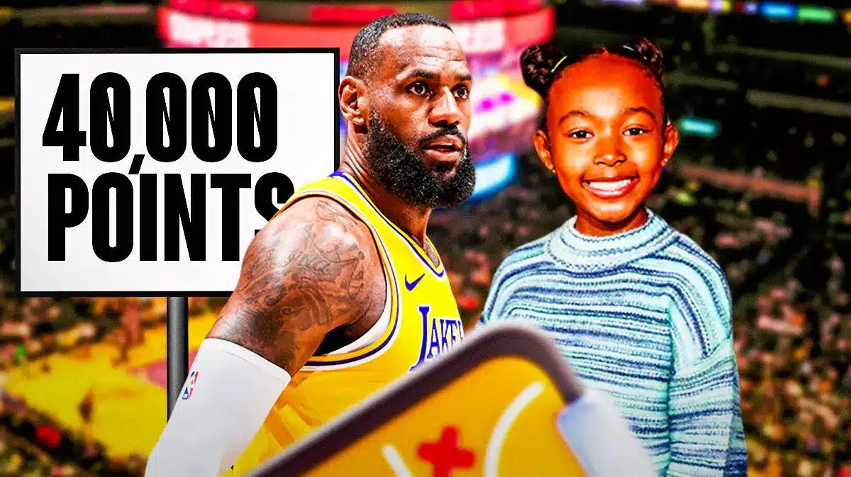 Lakers' LeBron James, with daughter Zhuri. 40,000 points sign in the back.