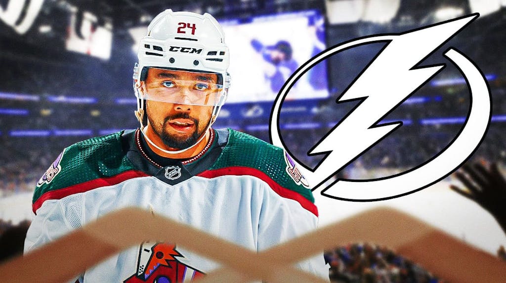 Matt Dumba standing with Lightning logo and rink in background