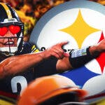 Steelers Mason Rudolph with hearts in his eyes pointing at a Steelers logo.