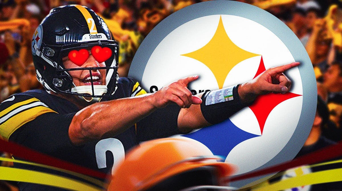 Steelers Mason Rudolph with hearts in his eyes pointing at a Steelers logo.