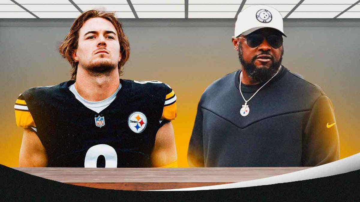 Photo: Kenny Pickett sitting down at a desk talking to Mike Tomlin, have Pickett in Steelers jersey