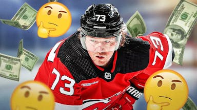 Devils' Tyler Toffoli skating, with thinking emojis beside him and cash falling from the sky