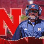 Nebraska football coach Matt Rhule stands next Big 10 logo,