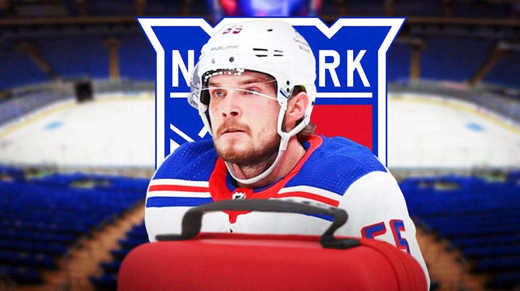 Ryan Lindgren looking stern, first aid kit, NY Rangers logo, hockey rink in background