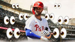 Phillies' Bryce Harper looking serious in middle. Place the eyes emoji all over image looking at Harper.