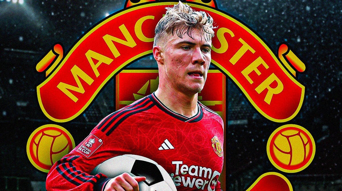 Rasmus Hojlund smiling in front of the Manchester United logo