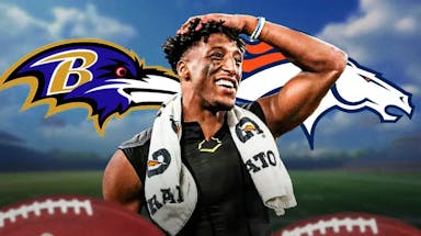 Michael Thomas standing in front of the Ravens and Broncos logos