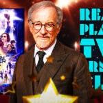 Steven Spielberg with Ready Player One poster and Ready Player Two book cover.