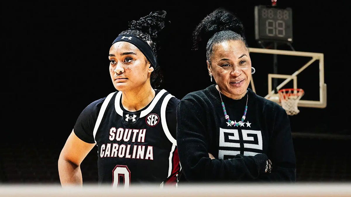 Te-Hina Paopao alongside Dawn Staley with the South Carolina Gamecocks arena in the background