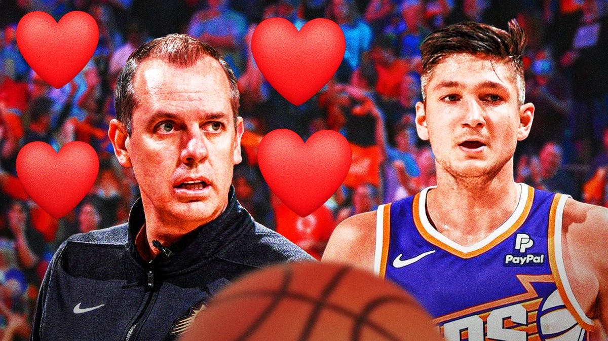 Suns' Frank Vogel with hearts around him while smiling at Grayson Allen