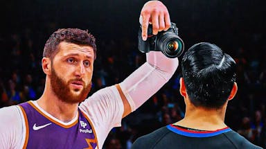 Suns' Jusuf Nurkic showing a camera to a referee a la Patrick Beverley