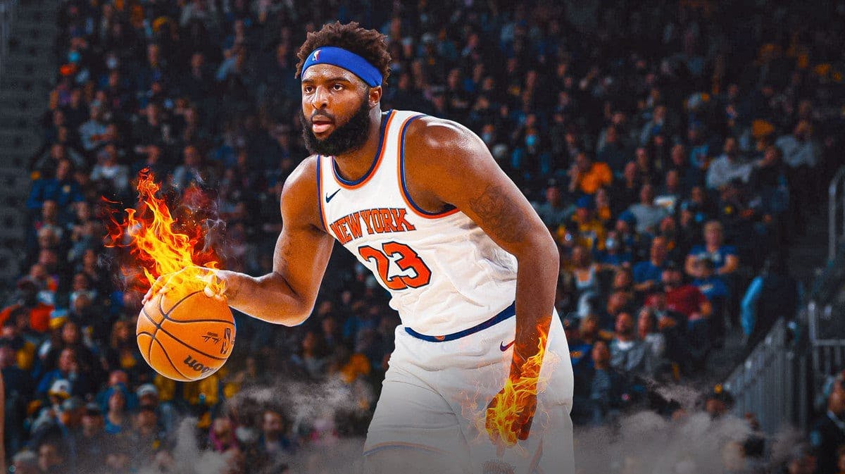 Mitchell Robinson with his hands on fire