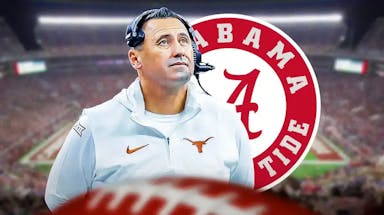 Texas football coach Steve Sarkisian with Alabama logo behind him.