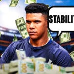 Photo: Juan Soto in Yankees jersey saying “Stability” with money flying around him