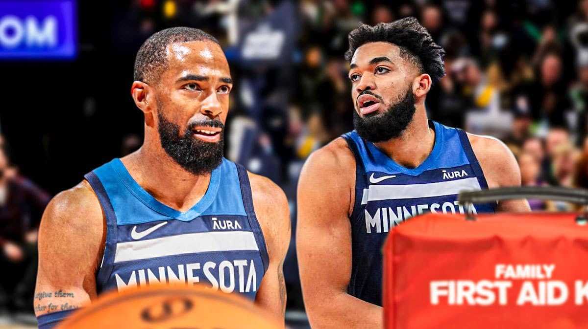 Photo: Mike Conley looking serious at Karl-Anthony Towns also looking serious, medical it beside Towns, both in Timberwolves jerseys