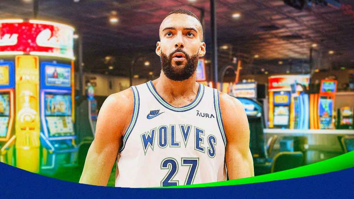 Timberwolves' Rudy Gobert looking serious, casino as the background