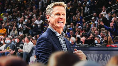 Steve Kerr looking angry with the Warriors arena in the background