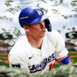 Dodgers catcher Will Smith with money around him.