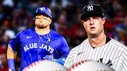 New York Yankee Gerrit Cole on the right, with Blue Jays' Daniel Vogelbach on the left.