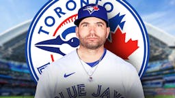 Joey Votto in a Blue Jays jersey in front of a Blue Jays logo at Rogers Centre