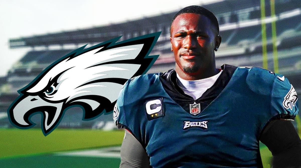 Devin White wearing an Eagles jersey next to an Eagles logo at Lincoln Financial Field