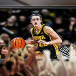 Iowa women’s basketball player Caitlin Clark in action playing basketball, inside of a television, with a cheering crowd