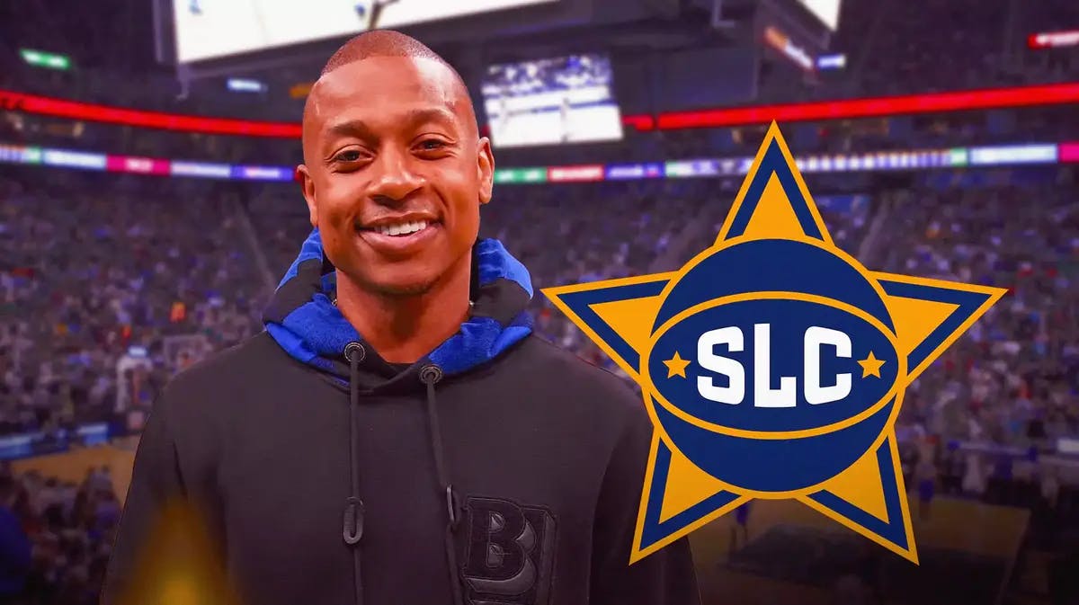 Ex-Celtics player Isaiah Thomas stands in front of Jazz G League team