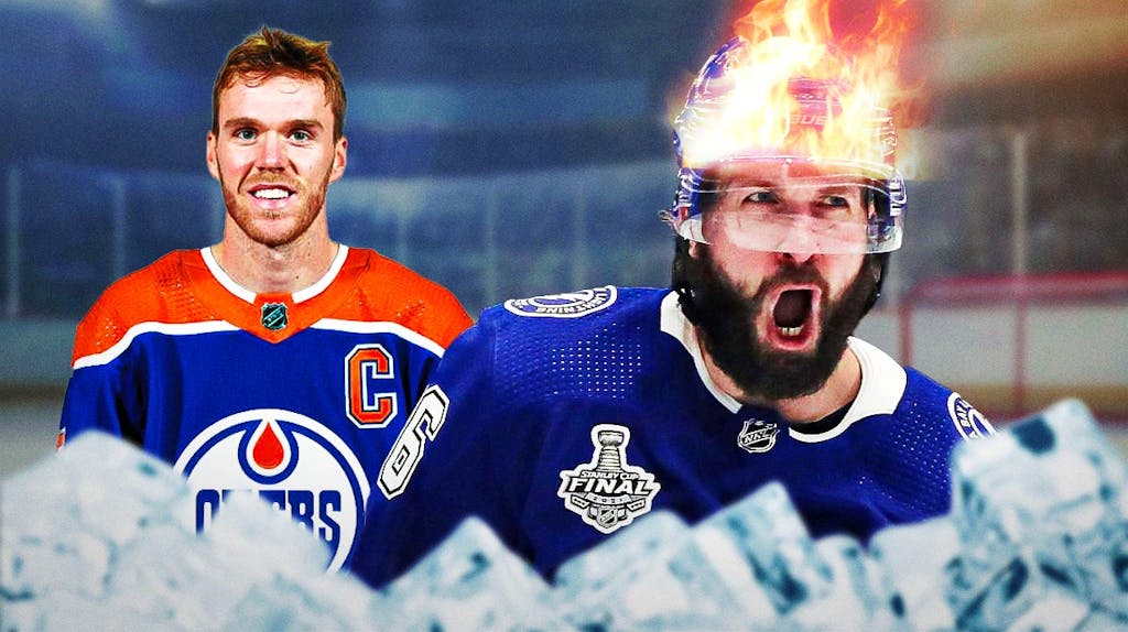 Nikita Kucherov yelling in excitement with fire off the top of his head (Tamp Bay Lightning). Connor McDavid behind him smiling (Edmonton Oilers)