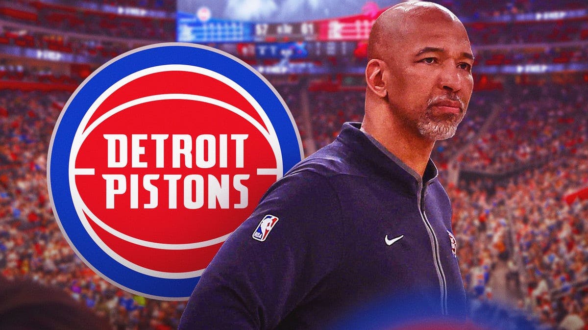 Monty Williams next to a Pistons logo at Little Caesars Arena