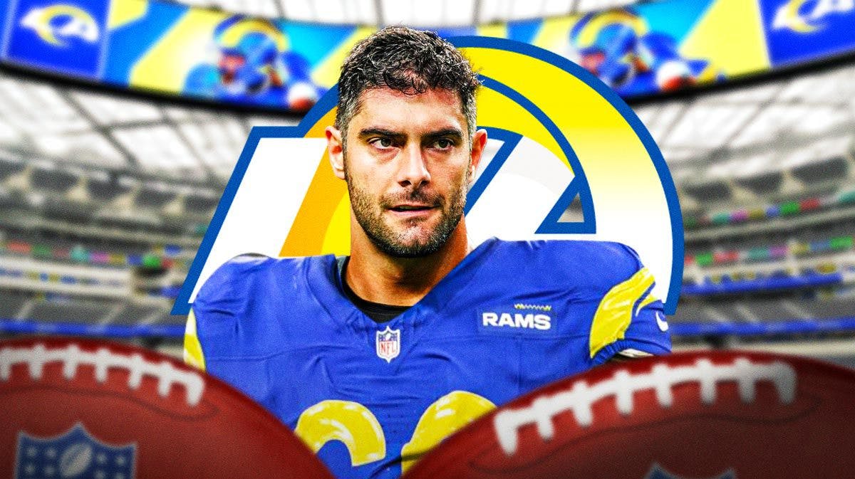 Jimmy Garoppolo in a Rams jersey in front of a Rams logo at SoFi Stadium