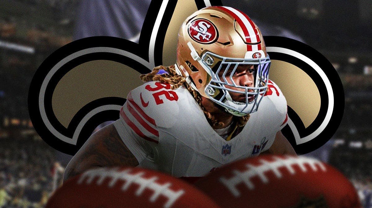 Former 49ers DE Chase Young stands in front of Saints logo after injury news, NFL free agency scouts stand on sideline