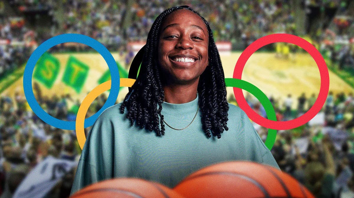 Seattle Storm player Jewell Loyd, with Olympic rings behind her