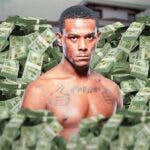 Jamahal Hill surrounded by piles of cash.