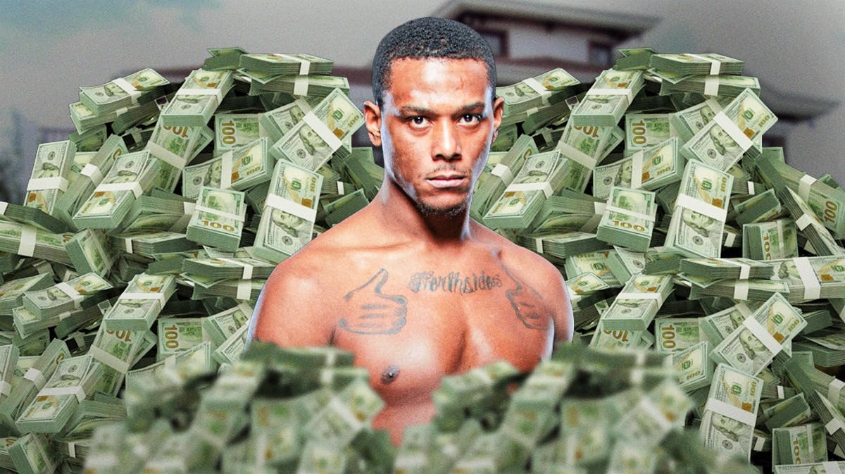 Jamahal Hill surrounded by piles of cash.