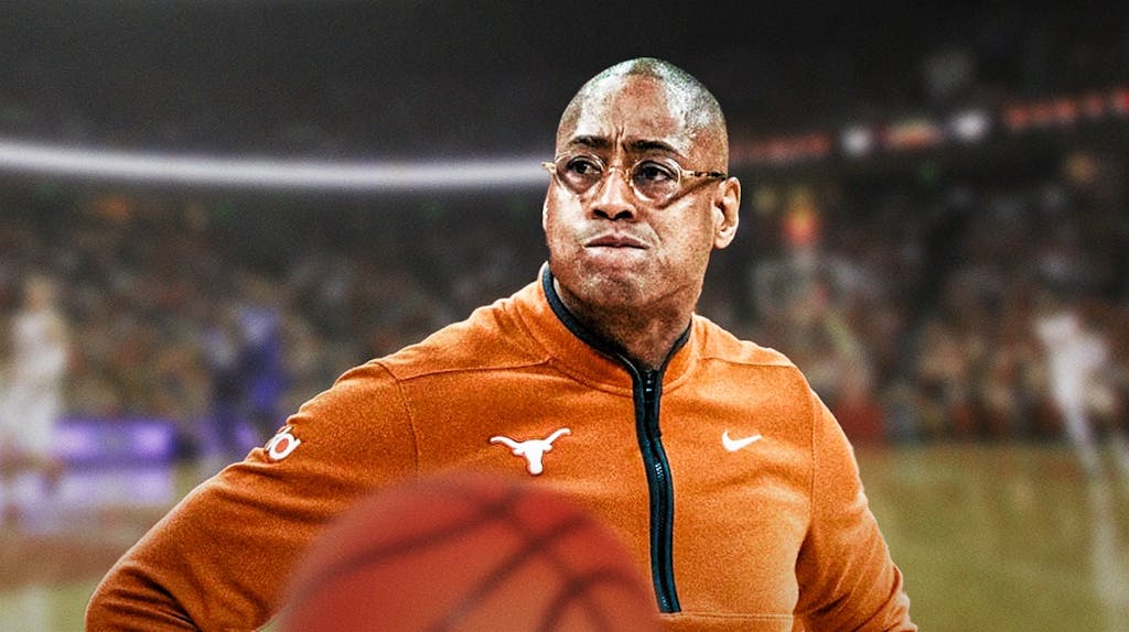 Texas basketball coach Rodney Terry looking frustrated.