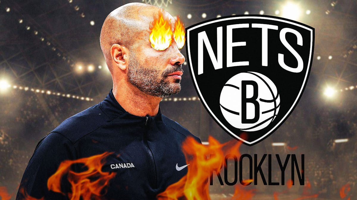 Jordi Fernandez with fire in his eyes. Nets logo in the background