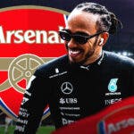 Lewis Hamilton laughing in front of the Arsenal logo
