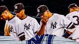 New York Yankees players looking down and defeated.