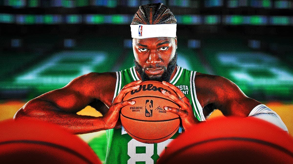 Neemias Queta looking hyped in a Celtics jersey.
