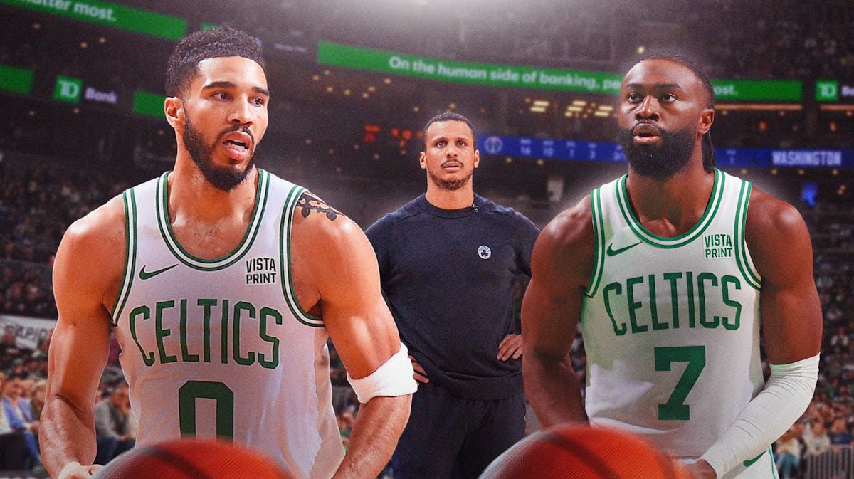 joe mazzulla looking focused on a TD Garden background with Jayson Tatum and Jaylen Brown to either side of him