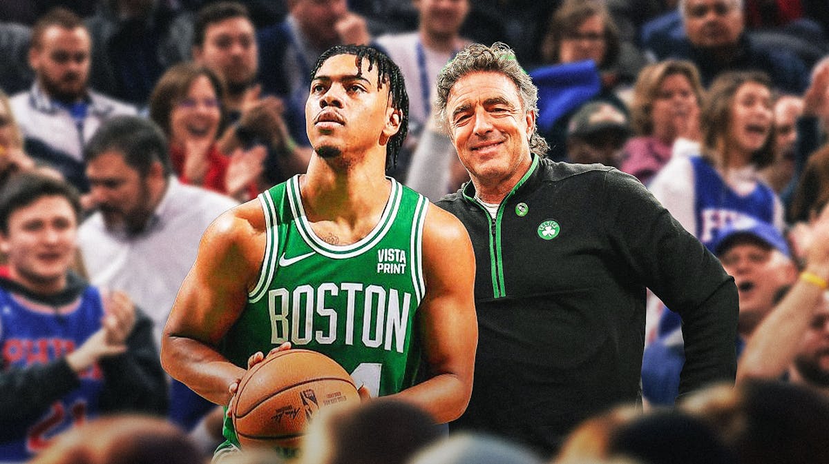 Wyc Grousbeck and Jaden Springer (Celtics jersey) both looking happy amidst a crowd of angry Philadelphia 76ers fans