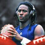 Denard Robinson (Michigan football t assistant director of player personnel) looking serious