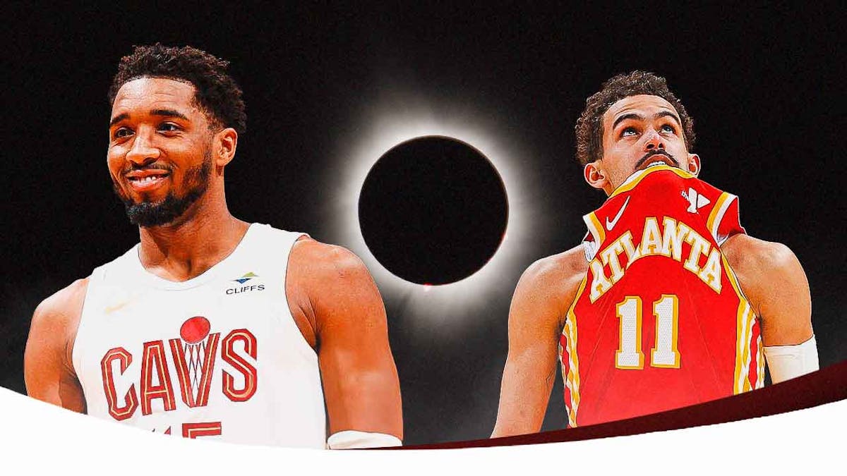 Cavs guard Donovan Mitchell stands next to Hawks' Trae Young, eclipse in background